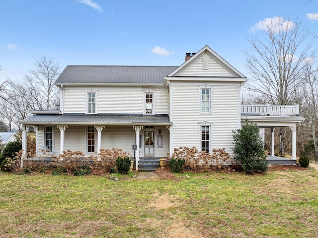 view of front facade featuring a front lawn and covered porch