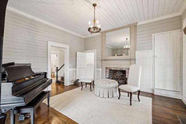 2111 Hoovers Rd, Duck River, TN 38454 - living area with a premium fireplace, dark hardwood / wood-style floors, a notable chandelier, and crown molding