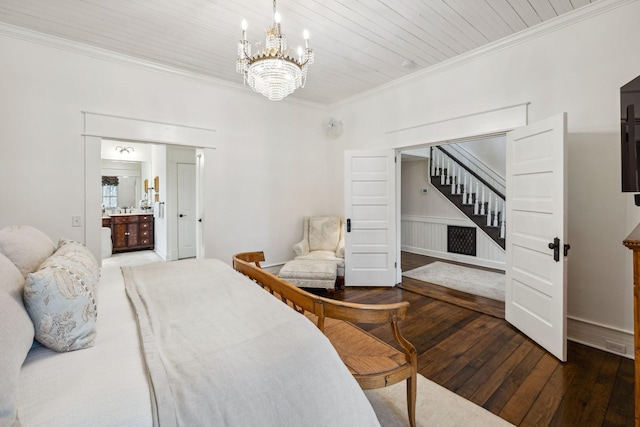 2111 Hoovers Rd, Duck River, TN 38454 - bedroom featuring connected bathroom, a notable chandelier, hardwood / wood-style flooring, and ornamental molding