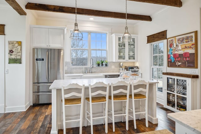 2111 Hoovers Rd, Duck River, TN 38454 - kitchen with light stone counters, sink, stainless steel fridge, and white cabinets