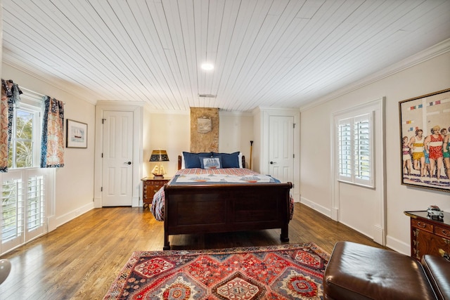 2111 Hoovers Rd, Duck River, TN 38454 - bedroom with multiple windows, ornamental molding, and light wood-type flooring
