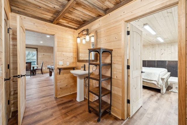 2111 Hoovers Rd, Duck River, TN 38454 - bathroom featuring hardwood / wood-style floors, wooden ceiling, beamed ceiling, and wood walls