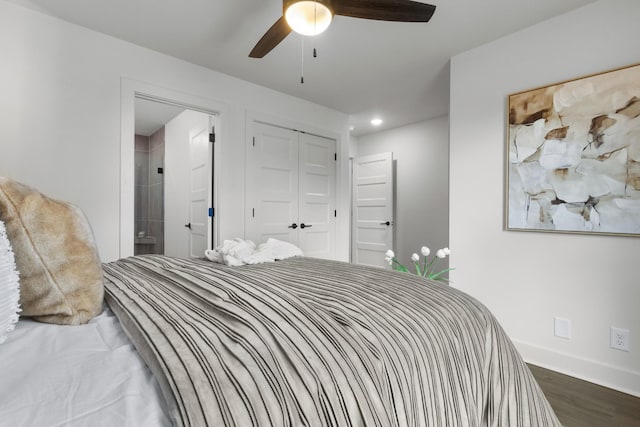 bedroom featuring ensuite bathroom, dark hardwood / wood-style floors, ceiling fan, and a closet