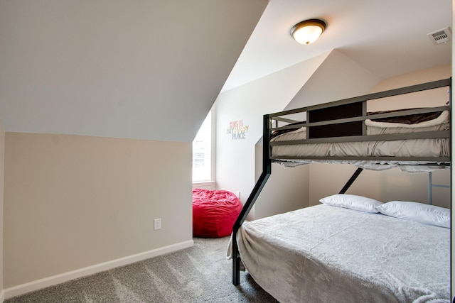 bedroom with lofted ceiling and carpet flooring