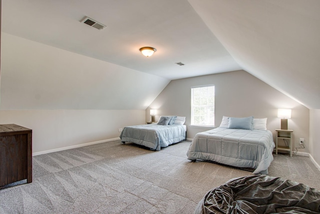 carpeted bedroom featuring vaulted ceiling