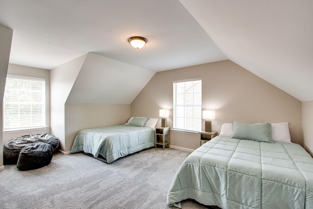 carpeted bedroom featuring lofted ceiling