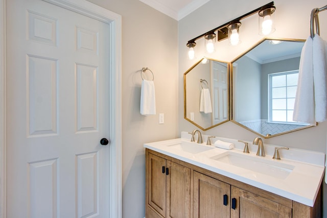 bathroom featuring crown molding and vanity