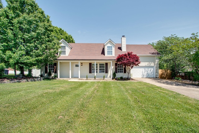 new england style home with a garage and a front lawn