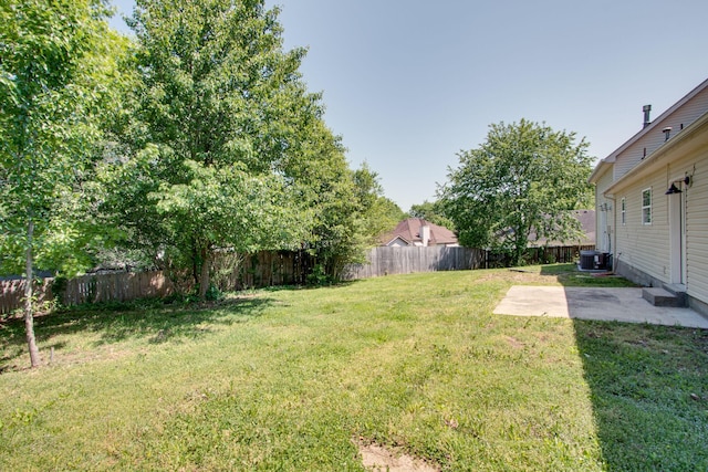 view of yard featuring central AC unit and a patio area