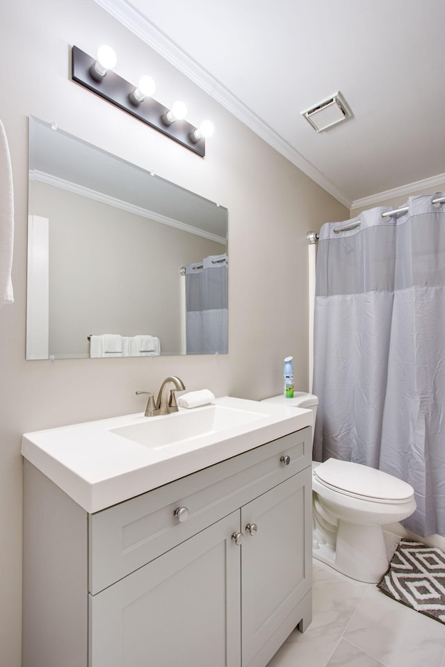 bathroom featuring vanity, crown molding, and toilet