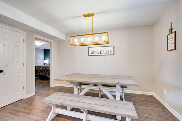 dining room featuring dark hardwood / wood-style floors and a wall mounted AC