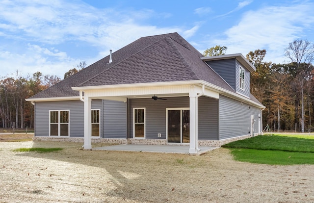 back of property featuring ceiling fan and a patio area