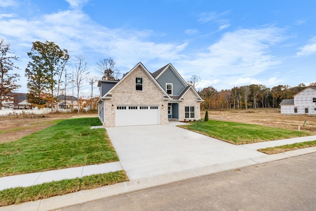 view of front of property featuring a garage and a front yard