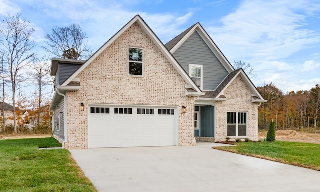 view of front of property with a garage and a front lawn