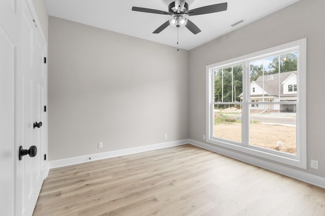 spare room with light hardwood / wood-style flooring and ceiling fan