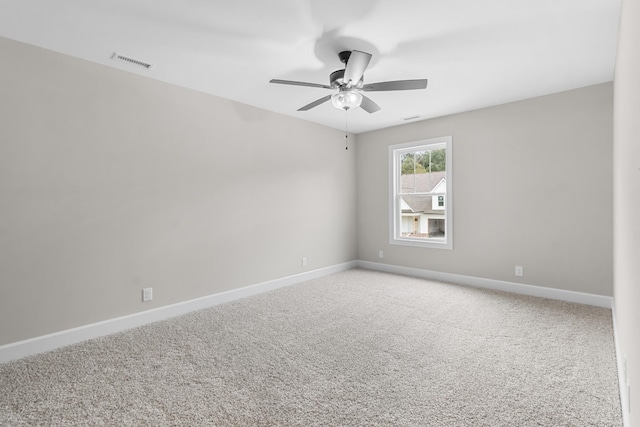 unfurnished room featuring carpet flooring and ceiling fan