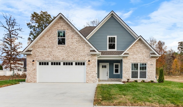 craftsman house featuring a garage and a front lawn