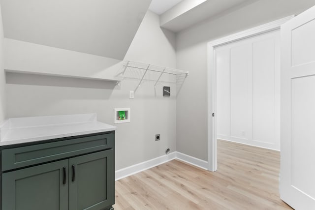 laundry room featuring light hardwood / wood-style floors, hookup for a washing machine, and electric dryer hookup