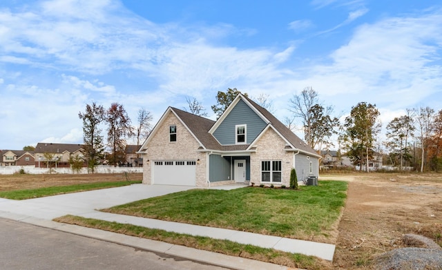 view of front of home featuring a garage, central AC, and a front lawn