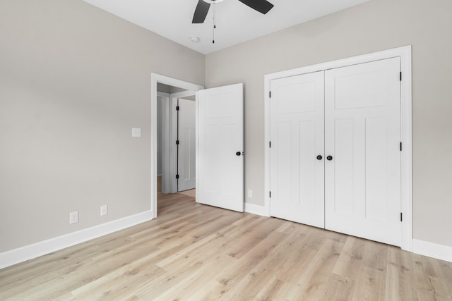 unfurnished bedroom featuring light hardwood / wood-style floors, a closet, and ceiling fan