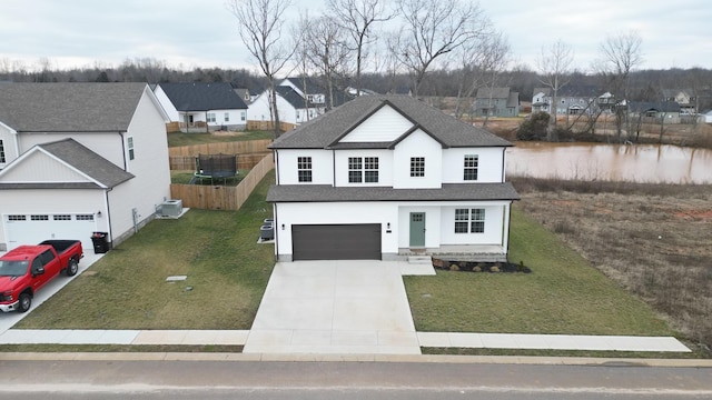 view of front of home featuring a garage and a front yard