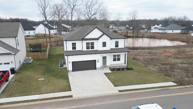 view of front of house featuring a garage and a front yard