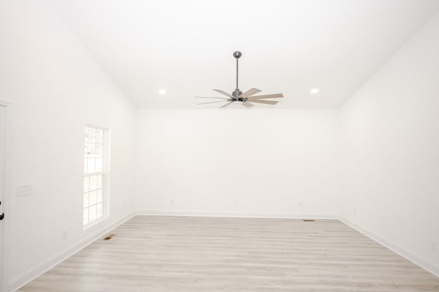 empty room featuring ceiling fan and light hardwood / wood-style floors