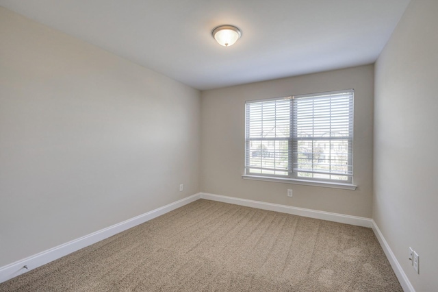 empty room featuring carpet flooring