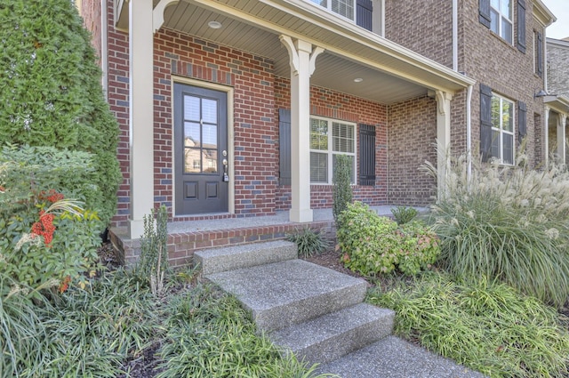 doorway to property featuring covered porch