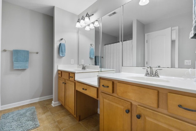 bathroom with vanity and tile patterned floors