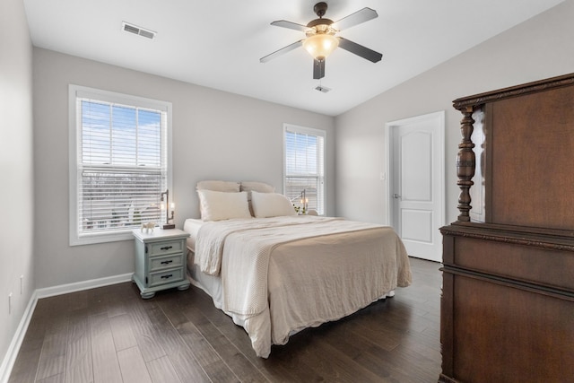 bedroom with lofted ceiling, dark wood-type flooring, and ceiling fan