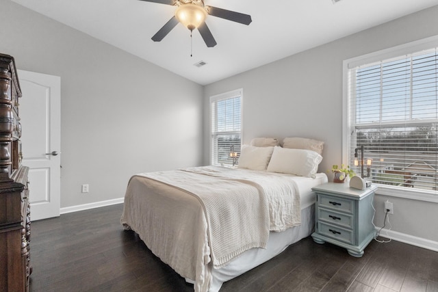 bedroom with dark wood-type flooring, ceiling fan, and lofted ceiling