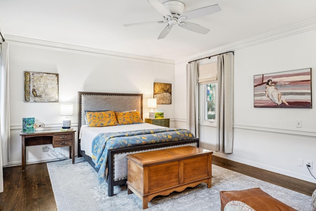 bedroom featuring wood-type flooring, ornamental molding, and ceiling fan