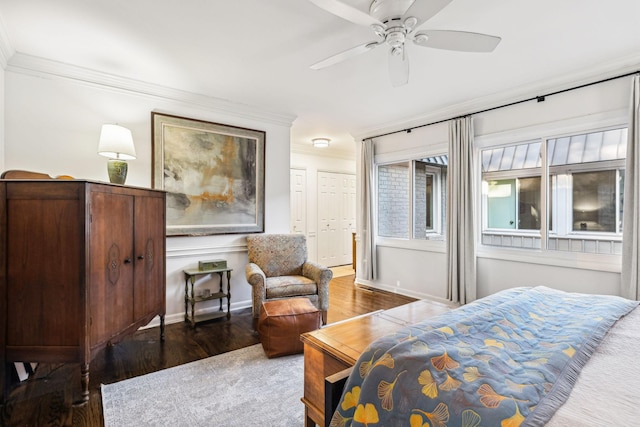 bedroom with ceiling fan, ornamental molding, and dark hardwood / wood-style flooring