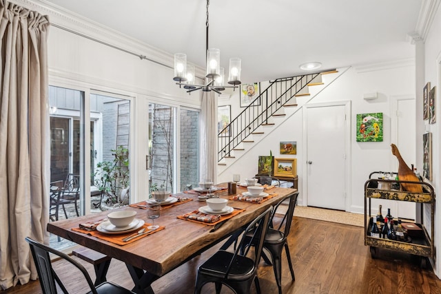 dining area featuring an inviting chandelier, crown molding, and dark wood-type flooring