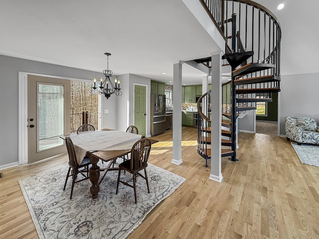 dining space with light wood-style flooring, recessed lighting, stairway, and baseboards