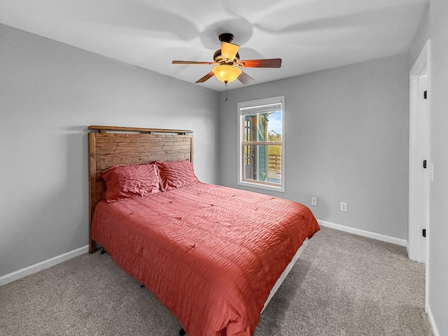 bedroom featuring carpet floors, a ceiling fan, and baseboards