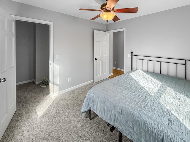 bedroom featuring carpet, a ceiling fan, and baseboards