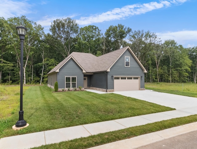 view of front of house with a garage and a front lawn