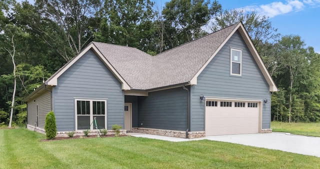 view of front of home with a garage and a front yard