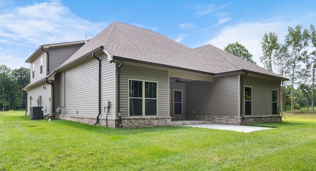 back of house with central AC unit, a patio area, ceiling fan, and a lawn