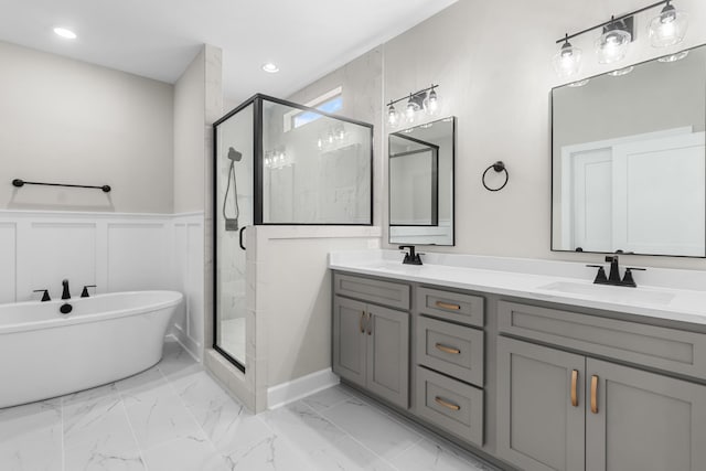 bathroom with vanity and separate shower and tub