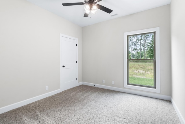 spare room with ceiling fan and carpet floors