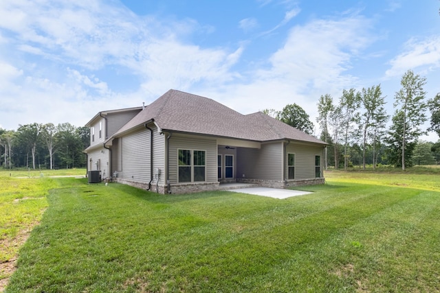 back of house featuring a patio, a yard, and central AC unit