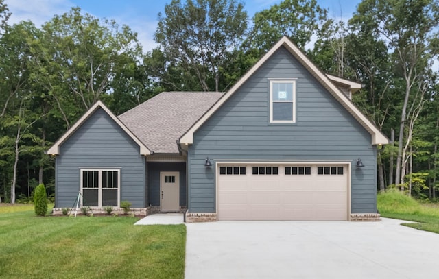 view of front of home featuring a garage and a front yard