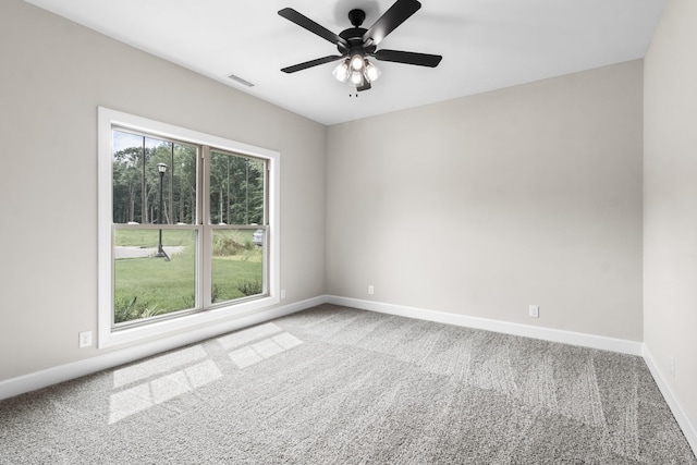 empty room featuring carpet and ceiling fan