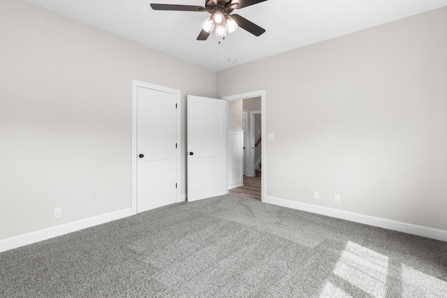 unfurnished bedroom featuring carpet flooring and ceiling fan