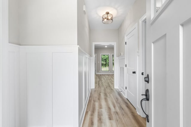 hall with light hardwood / wood-style flooring