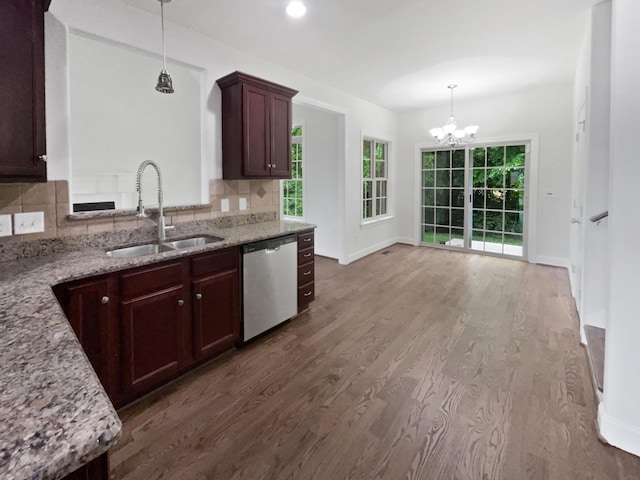 3047 Dogwood Trl, Spring Hill, TN 37174 - kitchen with a sink, dishwasher, wood finished floors, a chandelier, and backsplash