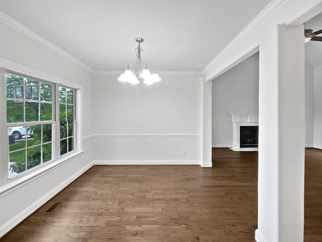 3047 Dogwood Trl, Spring Hill, TN 37174 - unfurnished dining area with ornamental molding, a chandelier, dark wood finished floors, baseboards, and a fireplace with flush hearth